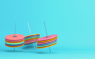 Abstract spinning discs on cyan background in pastel colors. Minimalism concept
