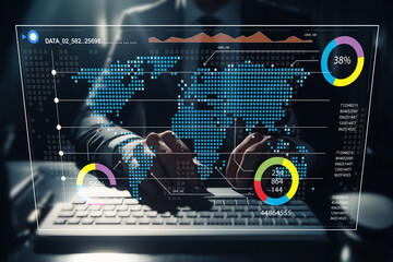 Futuristic Data Analytics Visualization with Global Map and Digital Graphics Overlaid on Hands Typing on Keyboard in Modern Office Setting
