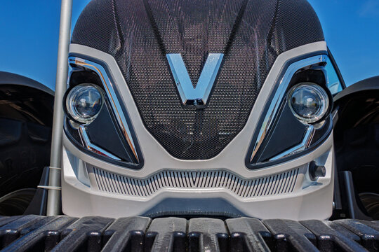 Ukraine, Kyiv - May, 17, 2019:Front View of a Modern Tractor Against a Clear Blue Sky Agriculture and Transportation