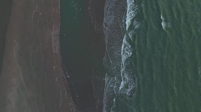 Top-Down Drone View of Waves Rolling onto the Beach | FlyLens 4K