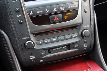 Old classic car multimedia system on dashboard. Lux car control panel. Conditioner and climate...