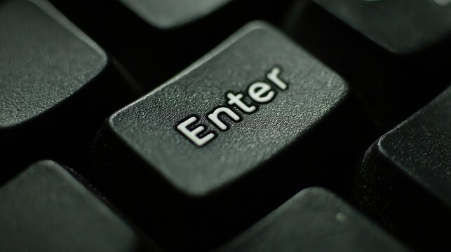Closeup of red Enter key on wooden background Technology concept with keyboard texture