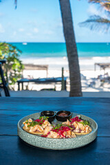 Obraz premium Shrimp Tacos on a Caribbean Beach in Boca Paila, Tulum.