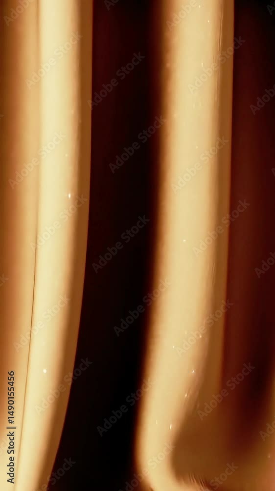 Aufkleber Golden Fabric Flowing: Abstract Motion of Shimmering Material in Warm Light