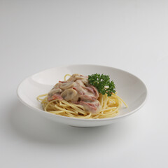 Spaghetti with mushroom sauce in a plate