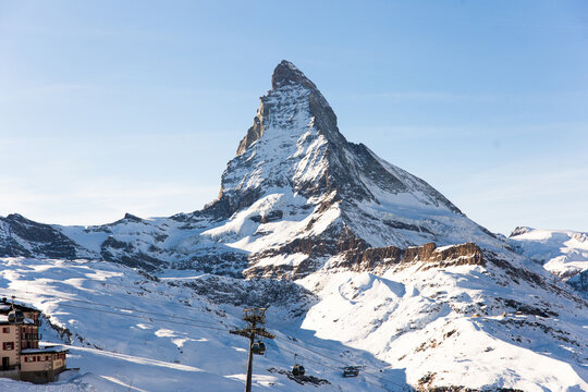 Snowy mountain Matterhorn during the day in winter. Zermatt, swiss alps