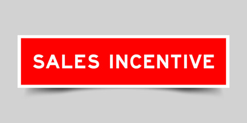Red color square shape sticker label with word sales incentive on gray background