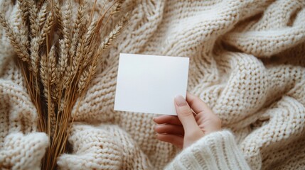 Blank White Card Mockup on Knitted Sweater