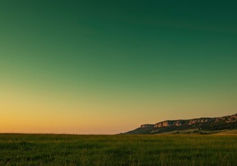 Fototapeta premium Sunset over prairie landscape