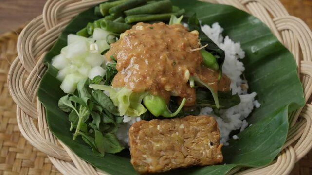 Cultural Food Showcase Pecel Served in Bamboo Plate