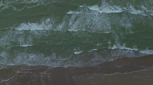 Static Top-Down Drone View of Waves Hitting the Shoreline | FlyLens 4K