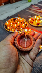 diwali candles in hands