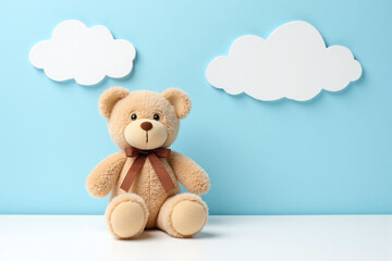 teddy bear sitting on top of a white table