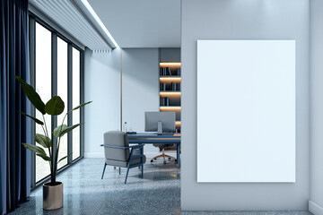 Fototapeta premium Modern office interior with blank vertical poster mockup on wall near desk and large windows, showcasing clean and minimalist workspace design. 3D Rendering