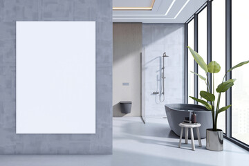 Vertical blank canvas mockup in modern bathroom interior with gray walls, freestanding tub, and large windows with city view background. 3D Rendering