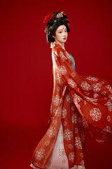 Tang Dynasty style female ancient costume makeup modeling on red background