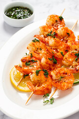 Fried shrimp, headless, on skewers, shrimp kebabs, with spices and herbs, grilled, homemade, without people,