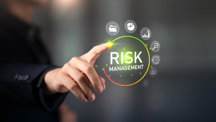 Risk management and reduction concept ,Business Investment Feasibility Assessment ,protection of business interests ,protection and risk management ,Businessman adjusts risk bar to low level