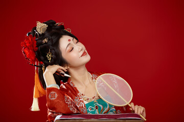 Tang Dynasty style female ancient costume makeup modeling on red background
