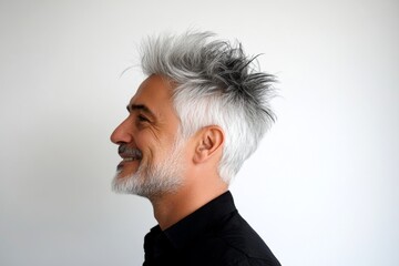 Trendy men's spiky hair haircut - midlife middle eastern man with middle hair. Pure white solid background. Visual idea of style for aging men. A modern and graceful man smiling naturally.