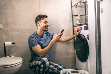 Man Using Washing Machine