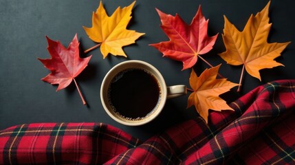 A warm beverage in a comforting mug, nestled amongst autumn leaves and a cozy plaid fabric, evokes a feeling of serenity and seasonal warmth.