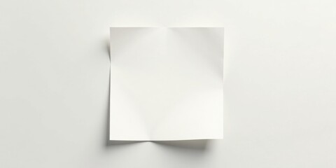 A Single Sheet of Unbleached Paper, Folded in Half, on a Plain White Surface, Ready for Your Message or Design