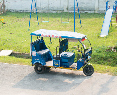 Empty e rickshaw or electronic rickshaw or toto waiting for passengers in the road.