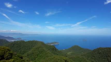 View from Khao-Khad Views Tower looking northeast to Andaman Sea, Ko Sire island, mountains. With interesting blue sky.