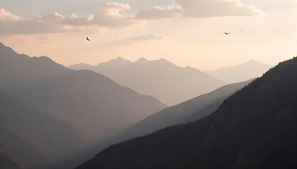 Obraz premium Misty mountain range background at dawn with layered silhouettes of peaks and a subtle gradient sky
