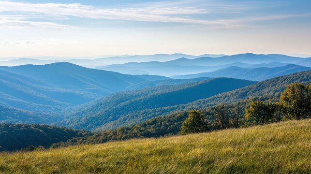 A breathtaking view from a mountain overlook, with rolling hills fading into the horizon