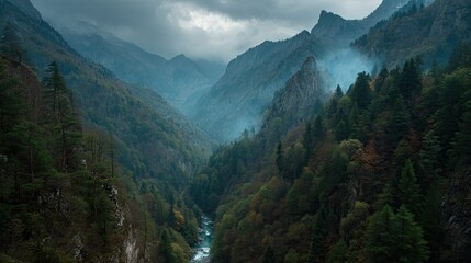 Obraz premium Majestic Mountains Embrace the Tranquil Valley Mist