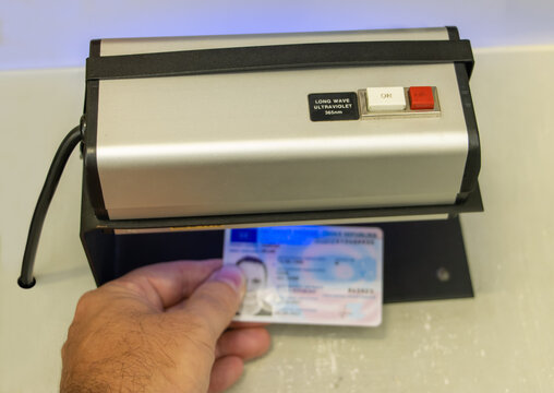 Verification of the validity of a personal identification document under ultraviolet light
