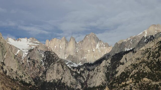 Clouds slowing moving over Mount Whitney in light and shadow. 