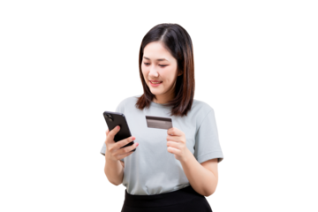 Asian young beautiful woman holding a smartphone and a credit card, smiling while making an online payment.