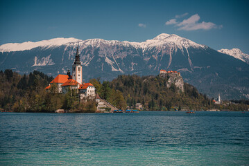 Bled, Slovenia - Aerial panoramic view of beautiful Bled Castle Blejski Grad with Lake Bled Blejsko Jezero , the Church of the Assumption of Maria and Julian Alps at background on a nice summer day