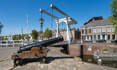 Historic cannon and wooden lifting bridge in the port of Goes, province of Zeeland, Netherlands.