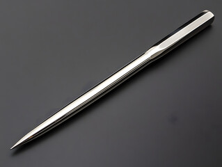 Sleek Metal Punch: A precision-crafted metal punch, gleaming with a polished silver finish, exudes quality and functionality.  Its sharp point and sturdy handle suggest durability and precision.