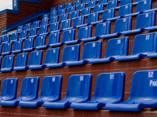 Obraz premium A row of blue seats with numbers on them
