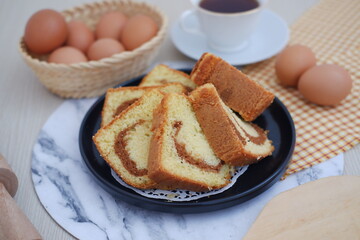 Delicious Sliced Marble Cake with Tea and Eggs