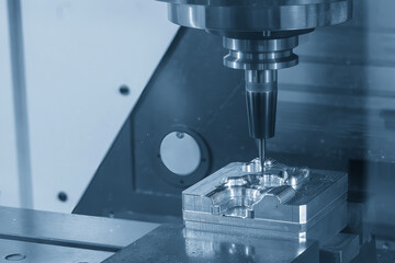 The CNC milling machine finish cut the mold parts by solid ball nose end mill tool in the light...