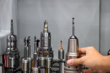 The group of cutting tools for CNC machine in the light blue scene.