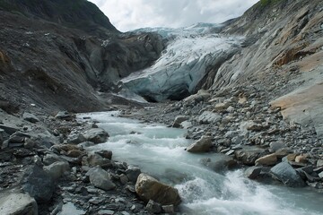 Close-up of Melting glacier forming a stream through a rocky valley.