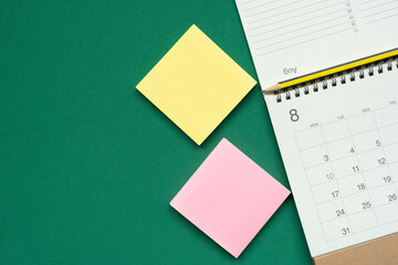 close up of calendar on the green table background, planning for business meeting or travel planning concept