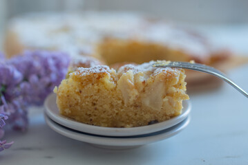 Freshly baked rhubarb crumble cake pieces on plate