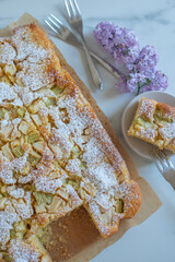 Freshly baked rhubarb crumble cake pieces on plate