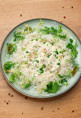 Creamy Risotto with Herbs on White Plate