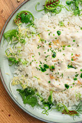 Creamy Risotto with Herbs on White Plate
