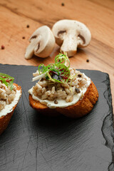 Mushroom Toasts on Wooden Board
