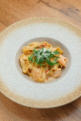 Lunch pasta bowl with greenery